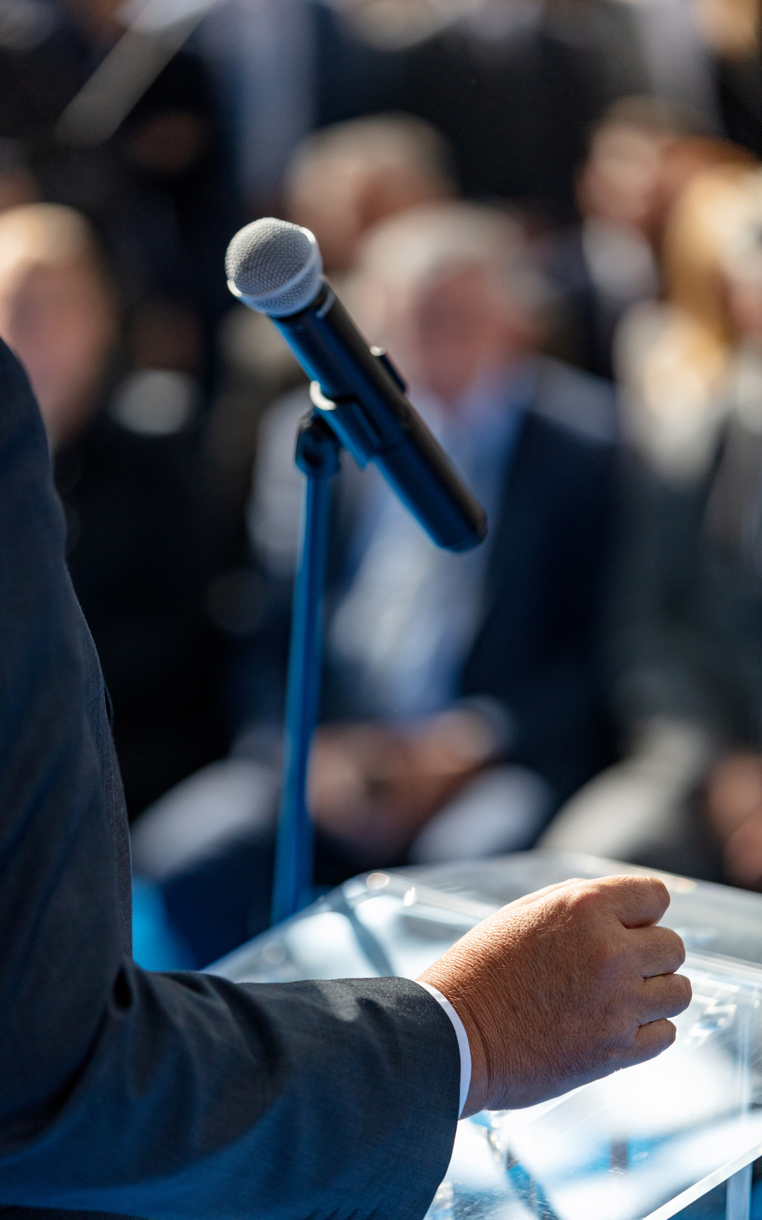 Giving speech at conference